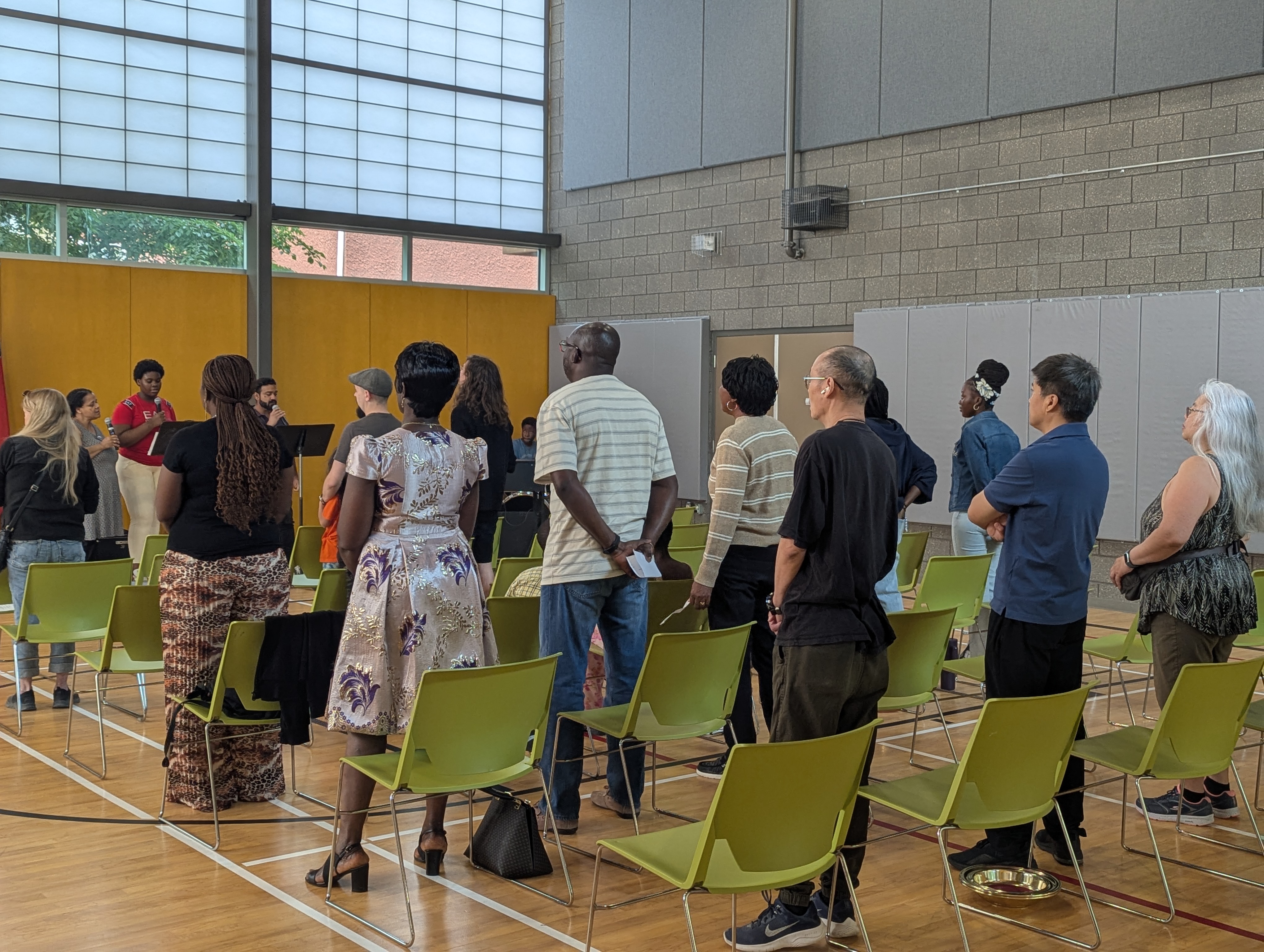 Congregants standing during a worship session