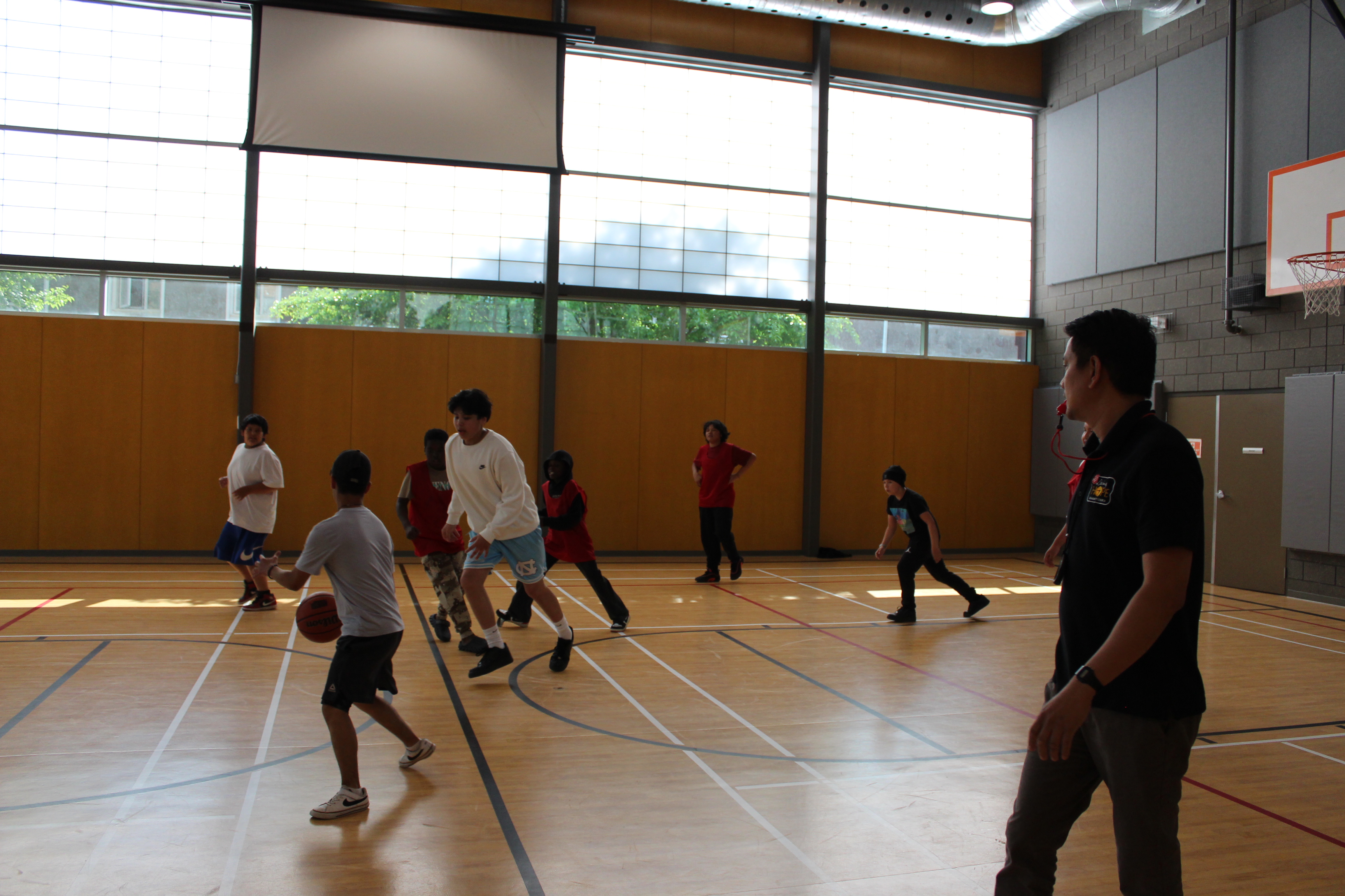 youths playing basket ball at the youth drop-in program offered by LHCC