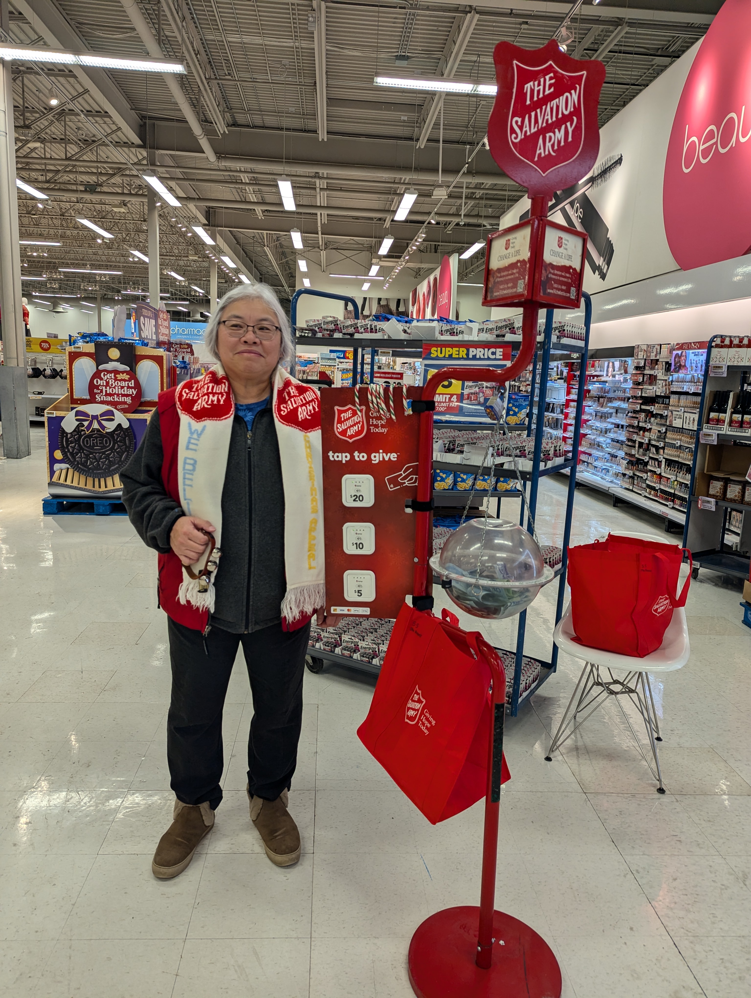 a volunteer for the christmas kettle at a grocery store location