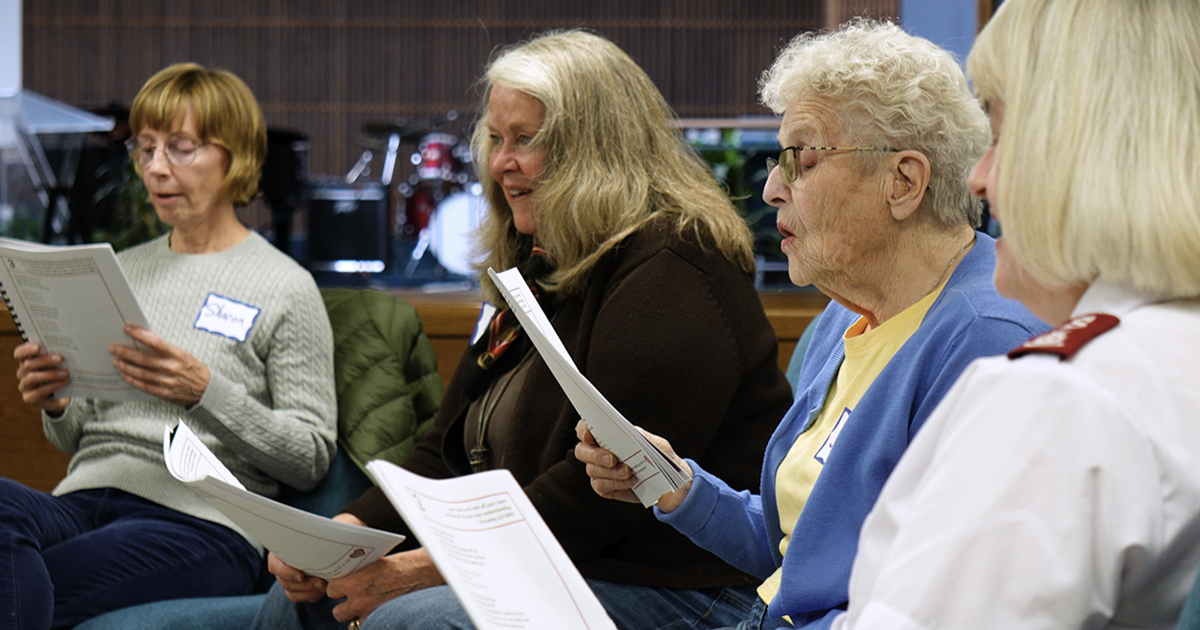 A group of four women singing